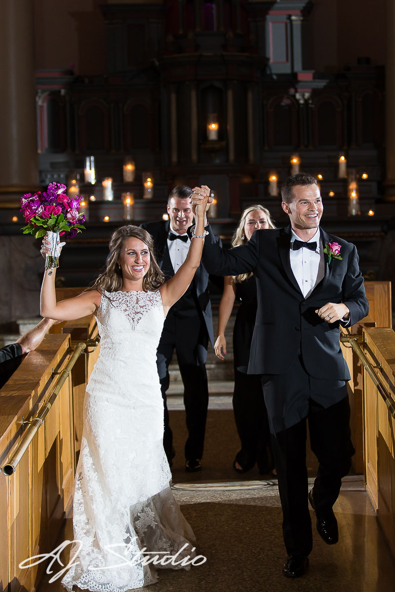 bride and groom walking down aisle