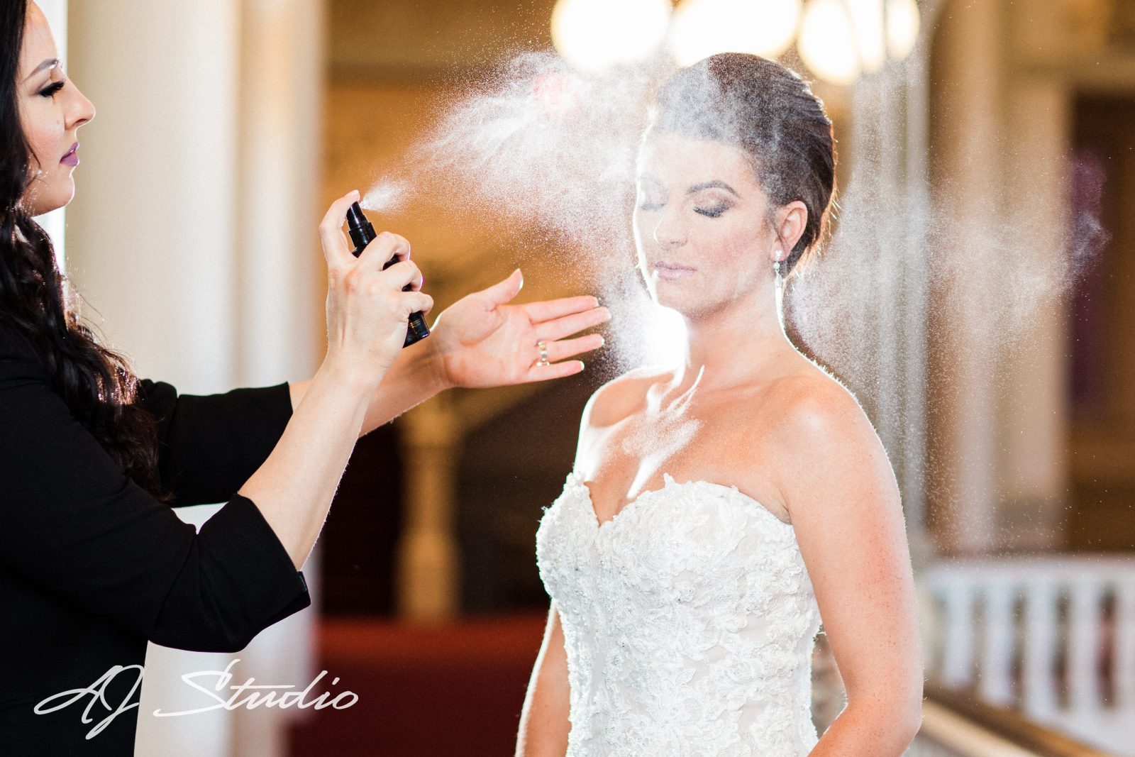 Bride getting makeup done