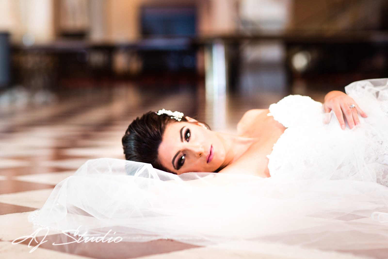 Bride laying on the floor in Cincinnati Music Hall