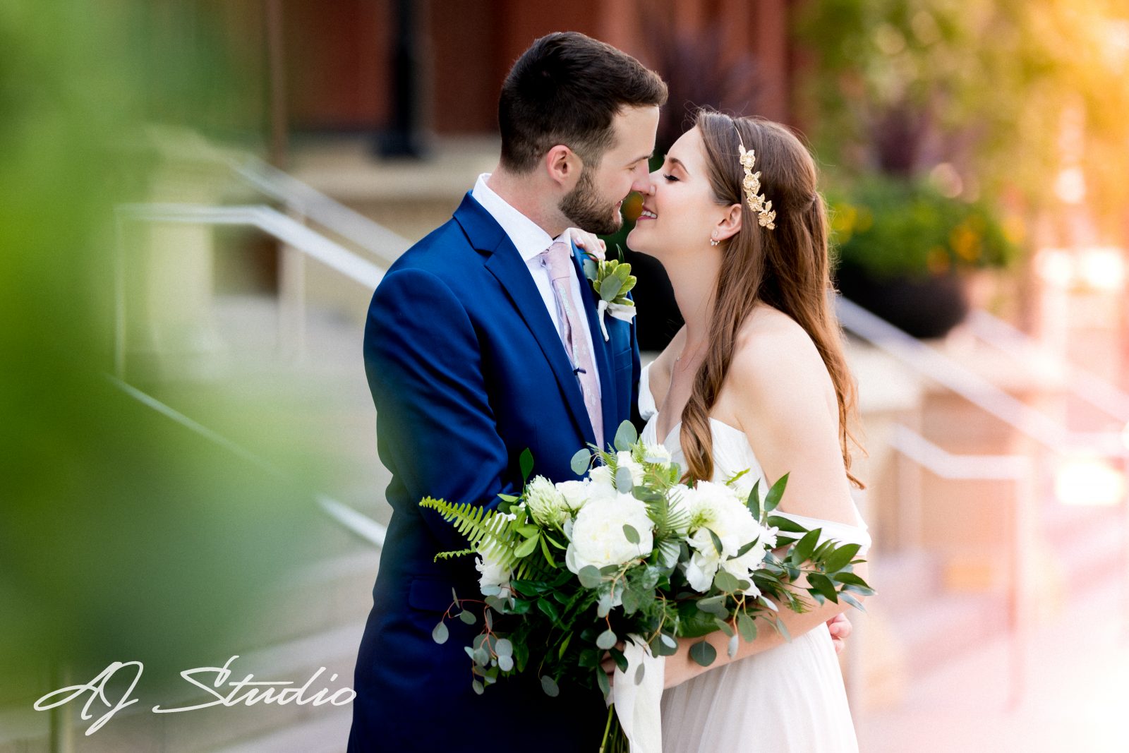 Bride and groom in front of music hall